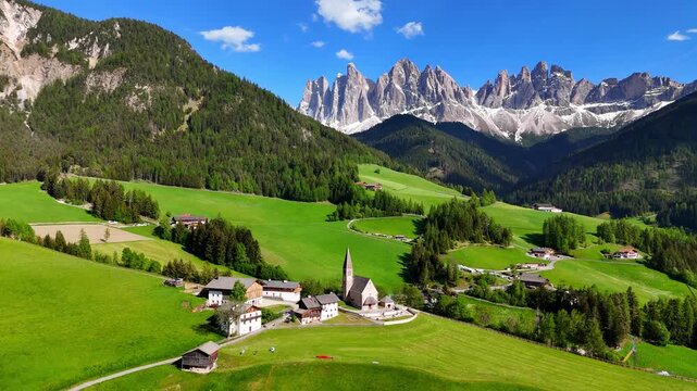 Aerial drone view of Santa Maddalena (Magdalena) village with the Dolomite mountains in the background. Val di Funes valley, Trentino-Alto Adige region. Italy, Europe.	