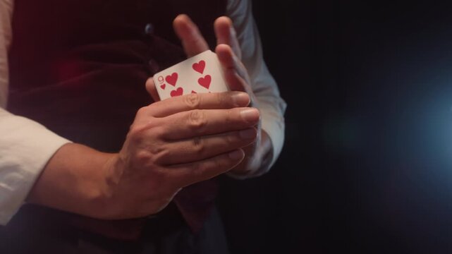 Magic trick, Professional croupier shuffling and dealing playing cards at a casino table, poker and blackjack game, magician performing a card trick shuffling cards deck