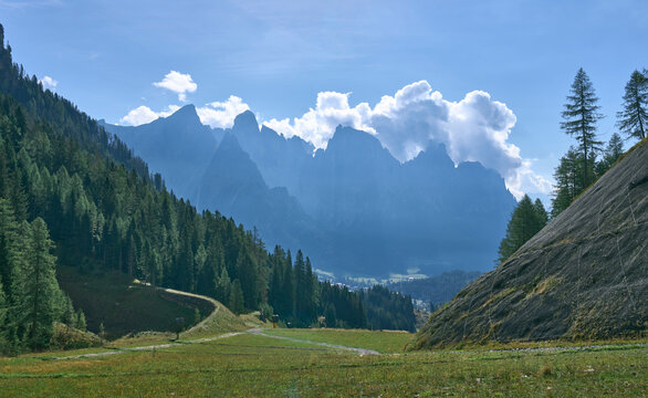 Impressive summits of Pale di San Martino mountain group - Cimon della Pala, Cima Vezanna, Cima Corona, Cima Rosetta as seen from a hiking trail near San Martino di Castrozza. Mountain silhouettes.