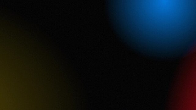 An abstract background featuring a soft light leak transition with vibrant blue, yellow, and red hues
