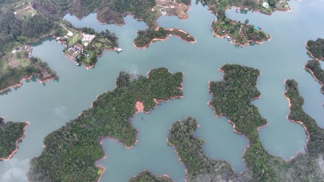 Scenic Guatap&eacute; Lake and Green Islands Surrounded by Mountains in Antioquia, Colombia. Establishing Shot. Aerial View.