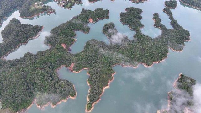 Scenic Guatap&eacute; Lake and Green Islands Surrounded by Mountains in Antioquia, Colombia. Establishing Shot. Aerial View.