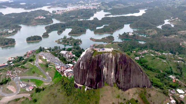 Aerial Panorama of Guatap&eacute; Reservoir and El Pe&ntilde;&oacute;n Surrounded by Islands and Mountains in Colombia. Establishing Shot.