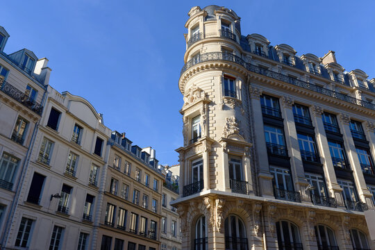 Ornate Art Nouveau corner tower building with rounded bay windows and carved reliefs, 2nd arrondissement, Paris, France