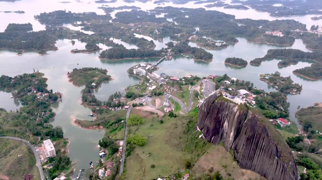 Aerial Panorama of Guatap&eacute; Reservoir and El Pe&ntilde;&oacute;n Surrounded by Islands and Mountains in Colombia. Establishing Shot.