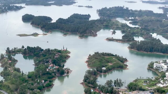 Aerial Panorama of Guatap&eacute; Reservoir and El Pe&ntilde;&oacute;n Surrounded by Islands and Mountains in Colombia. Establishing Shot.