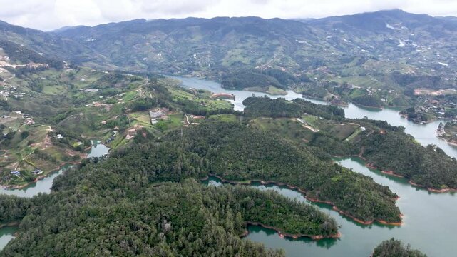 Guatap&eacute; Tourism Landscape with Piedra del Pe&ntilde;ol, Reservoir and Scenic Islands in Antioquia, Colombia. Establishing Shot. Aerial View.