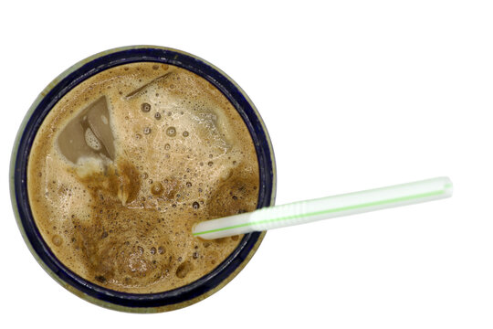 looking down at a iced coffee with a plastic straw Isolated on transparent background&nbsp;