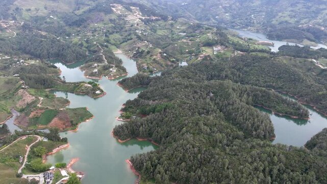 Guatap&eacute; Tourism Landscape with Piedra del Pe&ntilde;ol, Reservoir and Scenic Islands in Antioquia, Colombia. Establishing Shot. Aerial View.