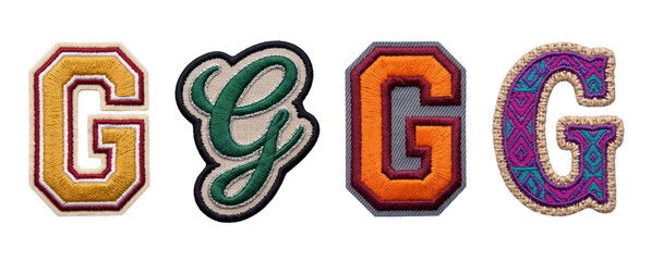 Set of four different embroidered letter G patches in various styles, fonts, and colors isolated on a white background © Septi.First