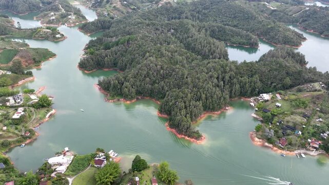 Guatap&eacute; Tourism Landscape with Piedra del Pe&ntilde;ol, Reservoir and Scenic Islands in Antioquia, Colombia. Establishing Shot. Aerial View.