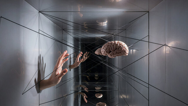 Conceptual Brain Suspended In String Network With Hands Reaching Out