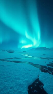 Frozen landscape illuminated by ethereal greenish-blue lights, natural phenomenon., snowy terrain