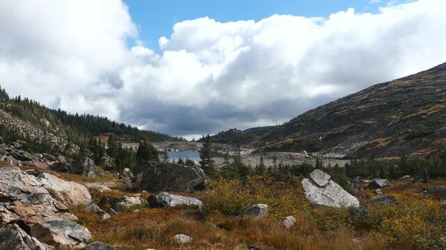 Lake Isabelle with Autumn Foliage and Moving Clouds in Colorado Rocky Mountains