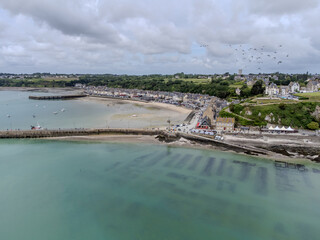 Aerial drone view of underwater oyster farms in Cancale, Brittany, covered during high tide, raditional sustainable aquaculture and production of premium French oysters, France © barmalini