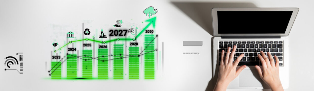 Green Growth Analysis with Laptop and Graph Showing Increasing Trend Over Time in Business Environment Sigmoid