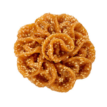 Moroccan chebakia twisted flower-like sesame pastry glazed with honey Isolated on White Background