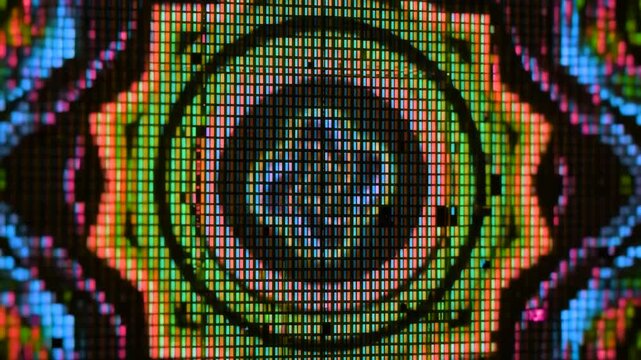 Vibrant abstract colorful mandala pattern rendered on a pixelated LED display screen texture isolated over a dark background. Perfect for VJ loops, concert visuals, psychedelic video backgrounds, elec