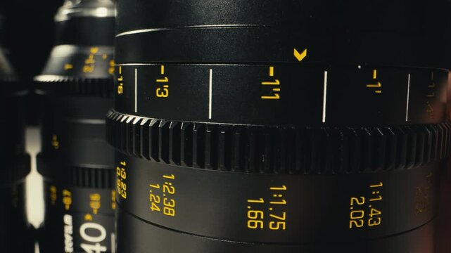 Camera operator working with cinema macro lens on film set behind the scenes production