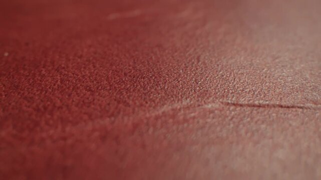 Genuine red leather texture, natural animal skin, luxury vintage cowhide background. Eco friendly leatherette, faux leather. Wallpapere, backdrop, copy space