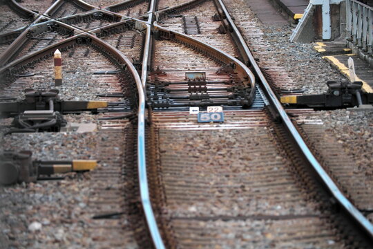 Railway tracks junction showing multiple directions for train travel