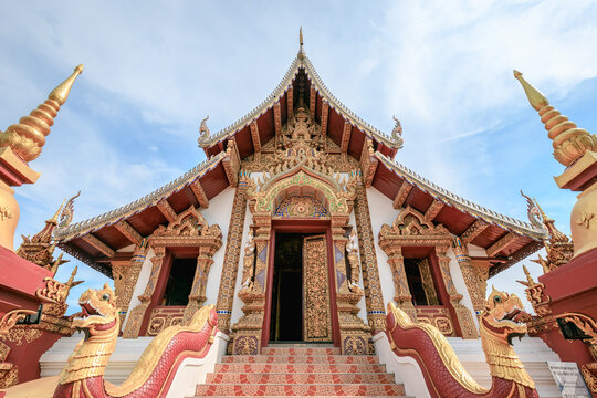 Architecture of a red Buddhist temple in Chiang Mai Old City, Thailand
