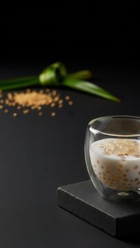 Gourmet Maldivian Saagu Bondibai Sago Pudding in Glass Bowl on Dark Stone with Copy Space