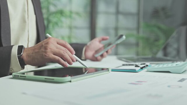 Analyst conducts market research with digital tablet tools as part daily research tasks, completing financial analysis across detailed charts finalize investment analysis reports.