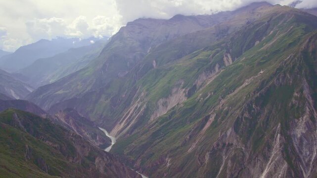 Panning shot of the deep Apurimac Canyon landscape from Capitan Rumi viewpoint in Curahuasi, Peru.