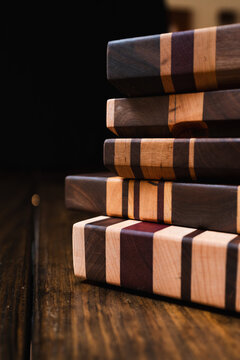 stack of cutting boards on wood table