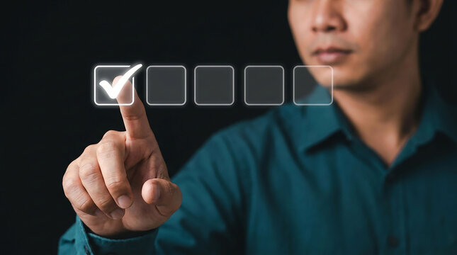Digital Selection: A focused man touches a virtual checkmark on a digital interface screen, symbolizing positive evaluation, quality assurance, and decision making.