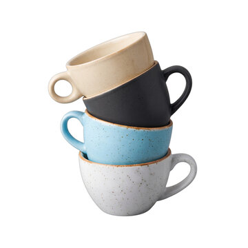 Stack of assorted colorful ceramic coffee mugs and teacups with speckles