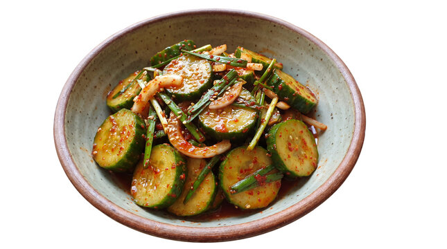 Spicy cucumber kimchi salad in ceramic bowl, traditional Asian pickled cucumber side dish, fresh seasoned oi muchim cuisine isolated PNG with Transparent Background