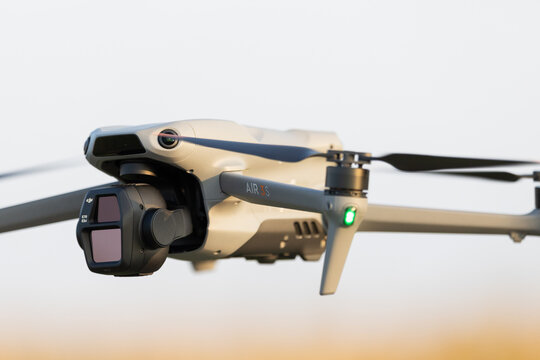 Poznan, Poland, 03 October 2026; DJI Air 3S Camera Drone Hovering Above a Field in Warm Sunlight with Copy Space