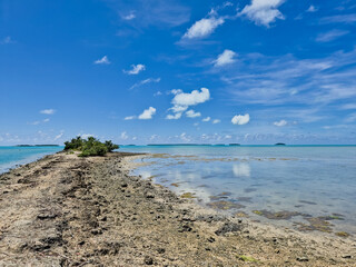 Tropical Sandbar Extending into a Turquoise Lagoon © Jessica