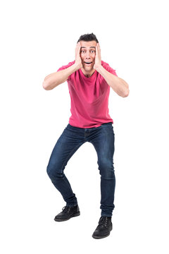 Excited man touching face in studio, transparent background