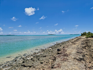 Tropical Sandbar with Turquoise Lagoon and Distant Islands © Jessica