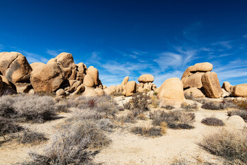 Weathered Desert Boulder Formation Beneath a Blue Sky © J Westermann-Blawert