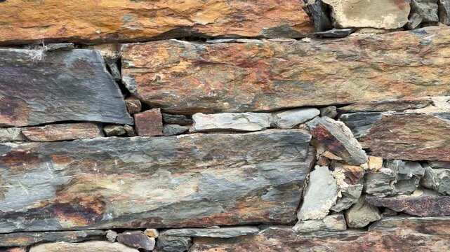 Patones close-up video of a rustic stone wall background
