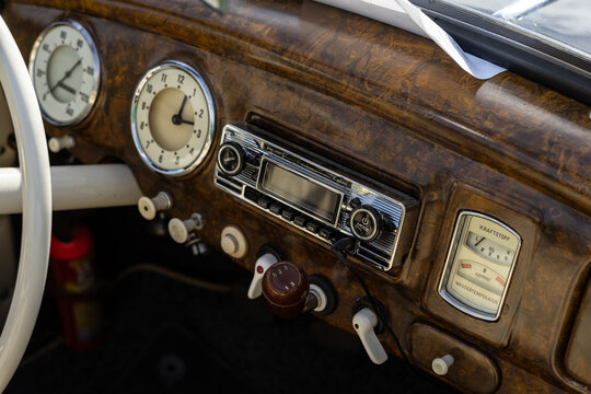 LAUSITZRING, GERMANY &ndash; SEPTEMBER 19, 2026: Dashboard with radio, clock and gauges of small family car IFA F9 (EMW 309), 1953-1956. DEKRA Klassik Tage (DEKRA Classic Days).
