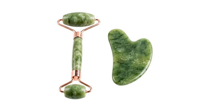Jade roller and gua sha stone on transparent background