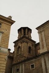 Stone Bell Tower Between Two Buildings © Viktor