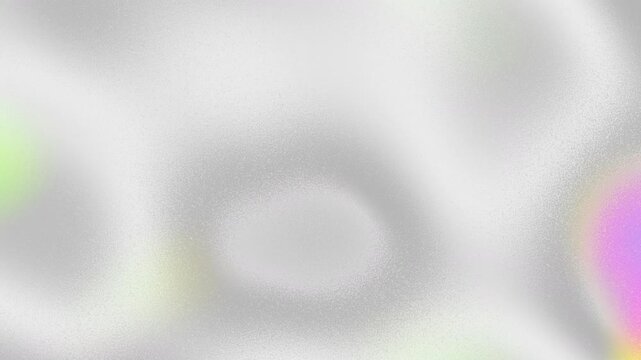 Colorful iridescent, holographic rainbow foil texture, gradient grain loop background. Noise textured surface.