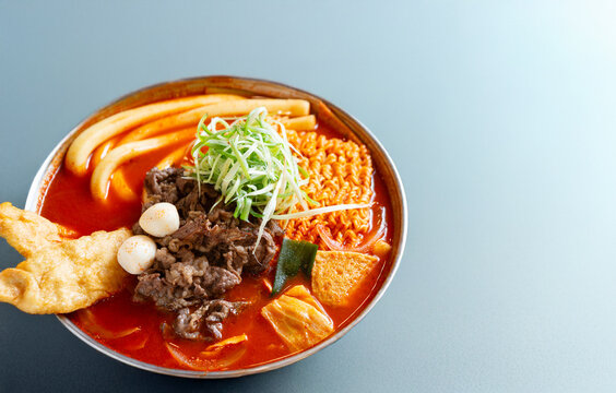 Gourmet Korean spicy stir-fried rice cakes known as Rabokki with marinated beef, ramen noodles