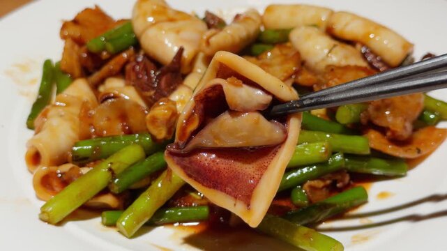 Chopsticks Lifting Stir Fried Cuttlefish Piece Qingdao Chinese Seafood Dish