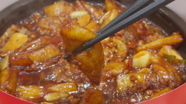 Chinese Minced Pork Eggplant Clay Pot Chopsticks Lifting Close-Up Qingdao