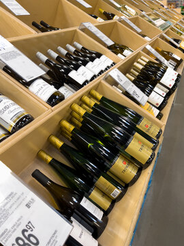 Wine Bottles Lined On Store Shelf Display