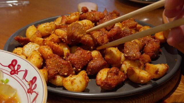 Chopsticks Lifting Barbecue Pork with Garlic Qingdao Chinese Dish