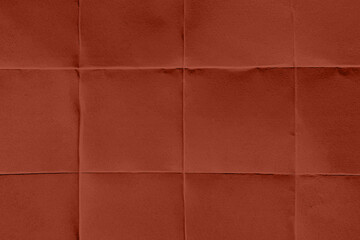 Fototapeta premium Abstract red quilted fabric texture background with soft folds