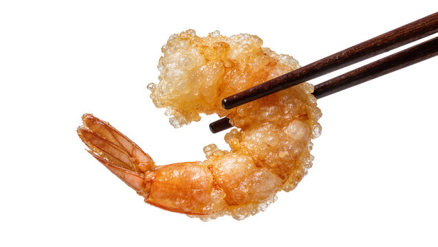 Crispy golden tempura shrimp held by dark wooden chopsticks, isolated on transparent background